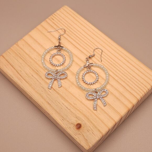 Sparkly Light Blue Circle Earrings with Bow – Cute and Elegant Handmade Jewelry - Picture 1 of 3